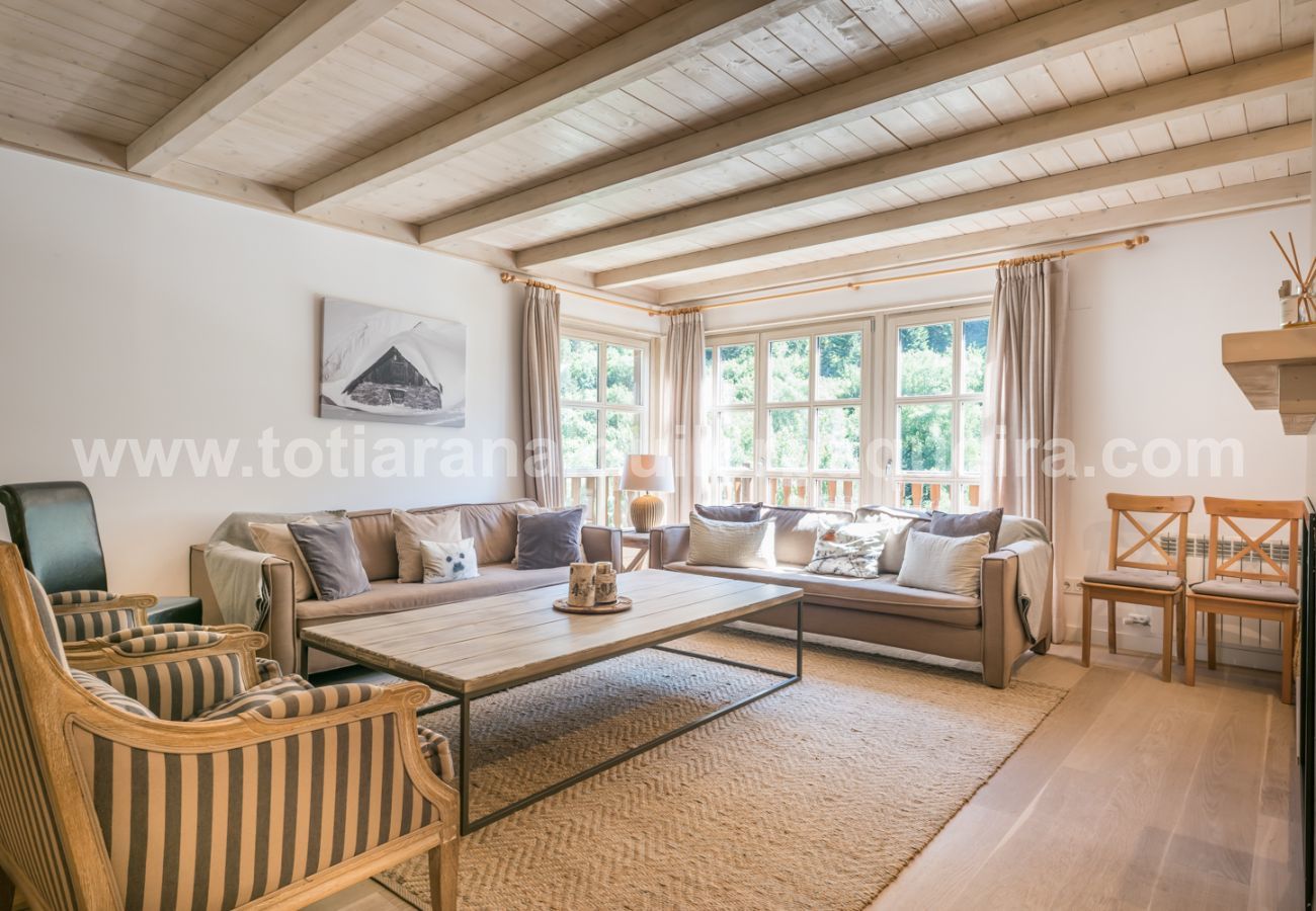 Living room of the house Eth Mur by Totiaran, Val de Ruda Urbanization, at the foot of the slopes